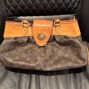 $2730 LV RARE TURNLOCK BAG (WEAR AND MARKS INSIDE)